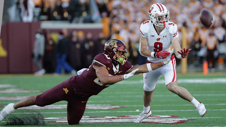 Wisconsin safety Scott Nelson (9) intercepts a pass intended for Minnesota tight end Brevyn Spann-Ford.