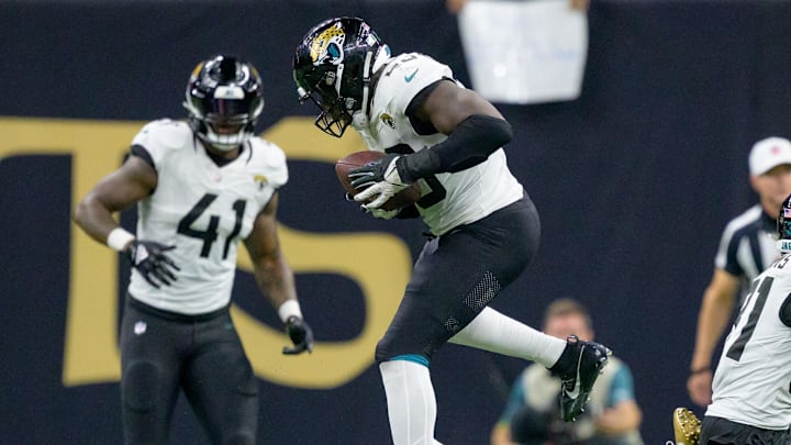 Oct 19, 2023; New Orleans, Louisiana, USA;  New Orleans Saints wide receiver Rashid Shaheed (22) intercepts the ball intended for Jacksonville Jaguars linebacker Foyesade Oluokun (23) in the third quarter at the Caesars Superdome. Oluokun returned the ball for touchdown. Mandatory Credit: Matthew Hinton-Imagn Images