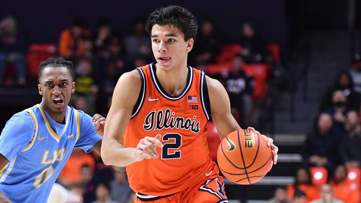 Nov 22, 2025; Champaign, Illinois, USA; Illinois Fighting Illini guard Andrej Stojakovic (2) drives the ball past Long Island University Sharks guard Greg Gordon (2) during the first half at State Farm Center. Mandatory Credit: Ron Johnson-Imagn Images Nov 22, 2025; Champaign, Illinois, USA; Illinois Fighting Illini guard Andrej Stojakovic (2) drives the ball past Long Island University Sharks guard Greg Gordon (2) during the first half at State Farm Center. Mandatory Credit: Ron Johnson-Imagn Images