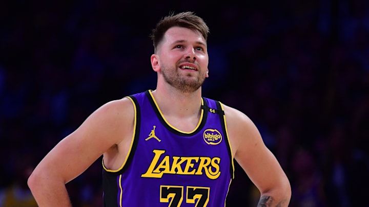 Feb 25, 2025; Los Angeles, California, USA; Los Angeles Lakers guard Luka Doncic (77) reacts against the Dallas Mavericks during the first quarter at Crypto.com Arena. Mandatory Credit: Gary A. Vasquez-Imagn Images
