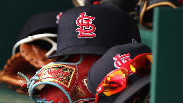 Apr 24, 2022; Cincinnati, Ohio, USA; A view of St. Louis Cardinals players    hats and gloves in the dugout during a game with the Cincinnati Reds at Great American Ball Park. Mandatory Credit: David Kohl-Imagn Images