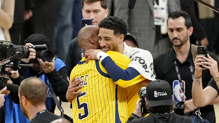 Reggie Miller hugs Indiana Pacers guard Tyrese Haliburton after winning game six of the 2025 NBA Finals between the Oklahoma City Thunder and the Indiana Pacers at Gainbridge Fieldhouse.