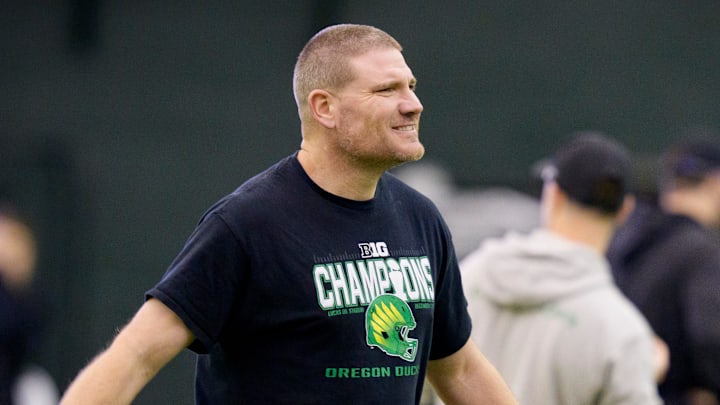 Oregon defensive coordinator Tosh Lupoi walks the field during an open practice ahead of the Orange Bowl at the Moshofsky Center in Eugene, Oregon on Dec. 27, 2025.
