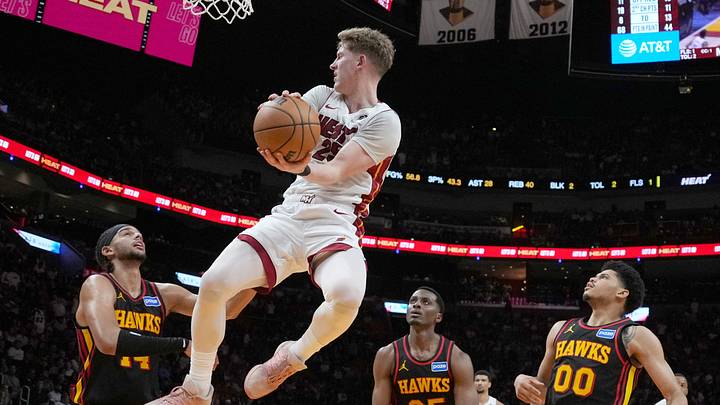 Apr 12, 2026; Miami, Florida, USA; Miami Heat guard Kasparas Jakucionis (25) passes against Atlanta Hawks forward Onyeka Okongwu (17), center Christian Koloko (35) and guard Rayj Dennis (00) during the second half at Kaseya Center. Mandatory Credit: Jim Rassol-Imagn Images Apr 12, 2026; Miami, Florida, USA; Miami Heat guard Kasparas Jakucionis (25) passes against Atlanta Hawks forward Onyeka Okongwu (17), center Christian Koloko (35) and guard Rayj Dennis (00) during the second half at Kaseya Center. Mandatory Credit: Jim Rassol-Imagn Images