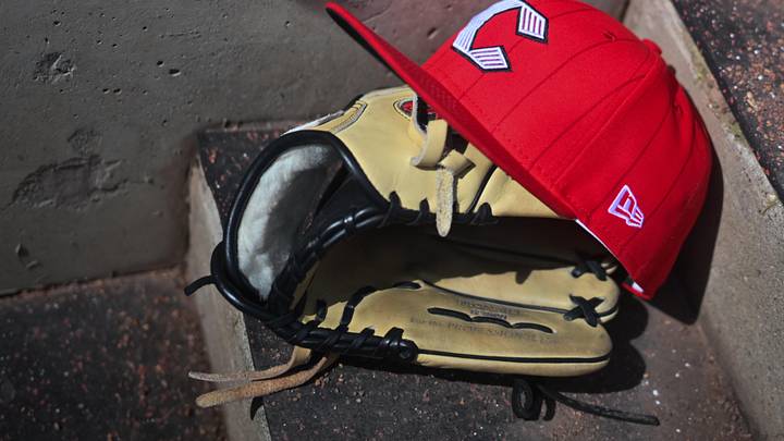 Apr 11, 2026; Cincinnati, Ohio, USA;  A view of an official Cincinnati Reds hat on the dugout steps during the game against the Los Angeles Angels at Great American Ball Park. Mandatory Credit: Aaron Doster-Imagn Images