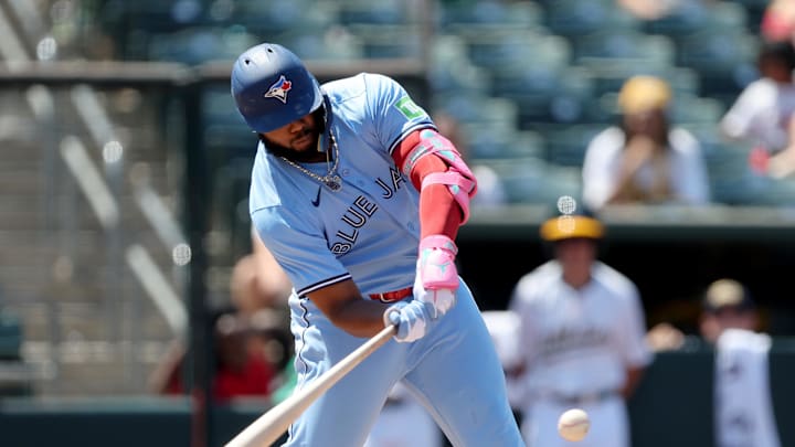 Toronto Blue Jays designated hitter Vladimir Guerrero Jr. (27) hits a single against the Athletics during the seventh inning at Sutter Health Park on July 13. 