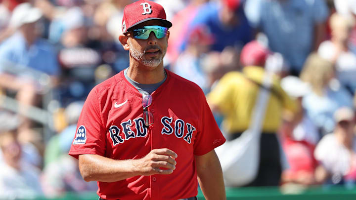 Boston Red Sox manager Alex Cora (13) looks on during the first inning against the Philadelphia Phillies at BayCare Ballpark.