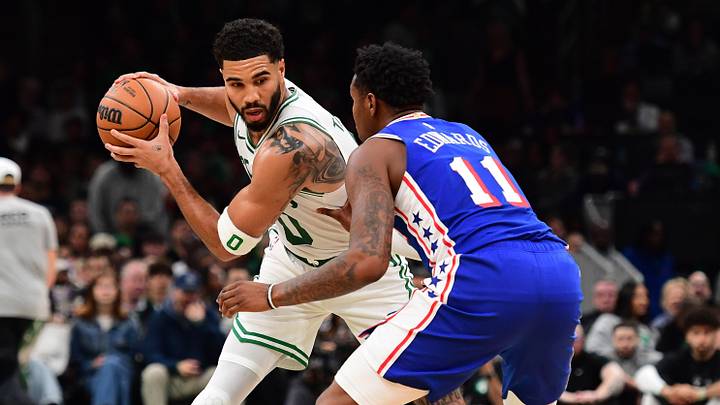 Oct 10, 2026; Boston, Massachusetts, USA;  Philadelphia 76ers forward Justin Edwards (11) defends Boston Celtics forward Jayson Tatum (0) during the second half at TD Garden. Mandatory Credit: Bob DeChiara-Imagn Images