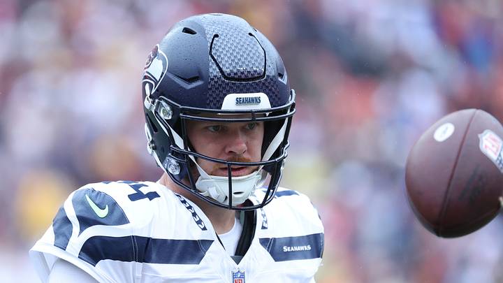 Seattle Seahawks quarterback Sam Darnold (14) practices on the sideline