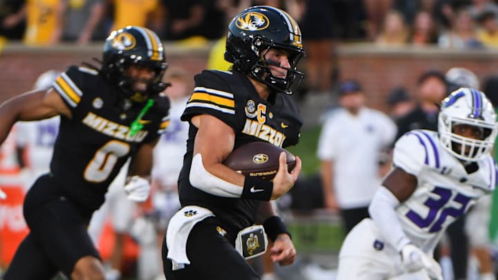 Aug 28, 2025; Columbia, MO, USA; Missouri Tigers quarterback Beau Pribula (9) scrambles during a game against the Central Arkansas Bears in Faurot Field at Memorial Stadium.