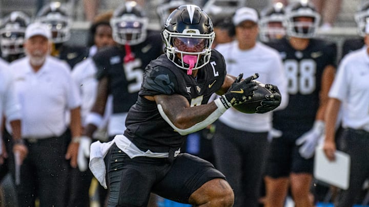 August 29, 2024: UCF Knights running back RJ Harvey (7) during first half NCAA, College League, USA football game between the New Hampshire Wildcats and the UCF Knights at FBC Mortgage Stadium in Orlando, FL. August 29, 2024: UCF Knights running back RJ Harvey (7) during first half NCAA, College League, USA football game between the New Hampshire Wildcats and the UCF Knights at FBC Mortgage Stadium in Orlando, FL.