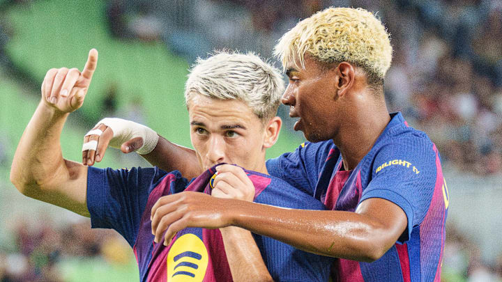 Gavi (left) and Lamine Yamal (right) celebrate a goal during preseason.