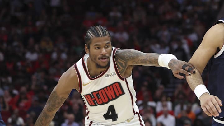 Mar 23, 2025; Houston, Texas, USA; Denver Nuggets guard Jamal Murray (27) drives with the ball around Houston Rockets guard Jalen Green (4) during the fourth quarter at Toyota Center. Mandatory Credit: Troy Taormina-Imagn Images