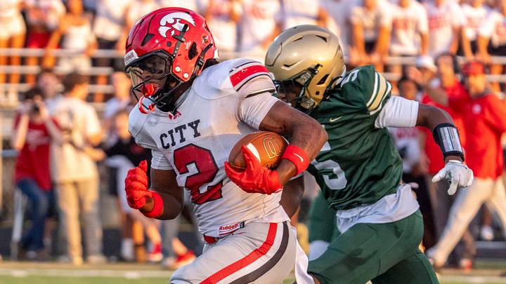 Iowa City High’s Savion Miller (2) runs to the endzone as Iowa City West’s Neil James (5) chases Aug. 28, 2026 during an Iowa High School football game at Iowa City West High School in Iowa City, Iowa.