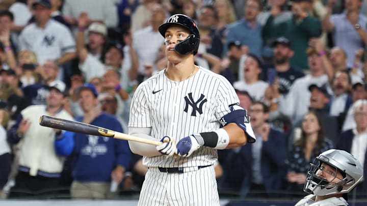 Oct 7, 2025; Bronx, New York, USA; New York Yankees outfielder Aaron Judge (99) hits a three-run home run in the fourth inning against the Toronto Blue Jays during game three of the ALDS round for the 2025 MLB playoffs at Yankee Stadium. Mandatory Credit: Vincent Carchietta-Imagn Images