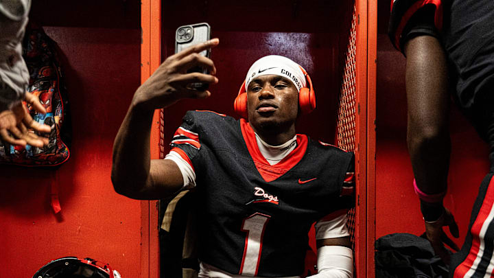 Brandon Corner Back Preston Ashley (1) looks at his phone before a high school football game between Petal and Brandon at Bulldog Stadium in Brandon, Miss., on Friday, Oct. 17, 2025. Petal defeated Brandon 27-21.