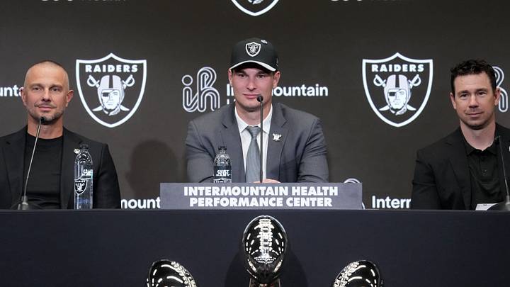Apr 24, 2026; Henderson, NV, USA; Las Vegas Raiders quarterback Fernando Mendoza (center) speaks at introductory press conference at Intermountain Health Performance Center flanked by general manager John Spytek (left) and head coach Klint Kubiak after being selected as the No. 1 pick in the 2026 NFL Draft. Mandatory Credit: Kirby Lee-Imagn Images Apr 24, 2026; Henderson, NV, USA; Las Vegas Raiders quarterback Fernando Mendoza (center) speaks at introductory press conference at Intermountain Health Performance Center flanked by general manager John Spytek (left) and head coach Klint Kubiak after being selected as the No. 1 pick in the 2026 NFL Draft. Mandatory Credit: Kirby Lee-Imagn Images