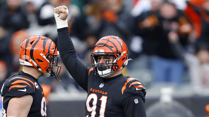 Jan 8, 2023; Cincinnati, Ohio, USA; Cincinnati Bengals defensive end Trey Hendrickson (91) celebrates the sack with defensive end Sam Hubbard (94) during the fourth quarter against the Baltimore Ravens at Paycor Stadium. Mandatory Credit: Joseph Maiorana-Imagn Images