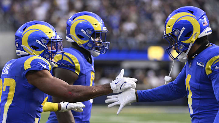 Oct 20, 2024; Inglewood, California, USA; Los Angeles Rams safety Quentin Lake (37) celebrates with cornerback Ahkello Witherspoon (4) after making a stop during the second half against the Las Vegas Raiders at SoFi Stadium. Mandatory Credit: Alex Gallardo-Imagn Images Oct 20, 2024; Inglewood, California, USA; Los Angeles Rams safety Quentin Lake (37) celebrates with cornerback Ahkello Witherspoon (4) after making a stop during the second half against the Las Vegas Raiders at SoFi Stadium. Mandatory Credit: Alex Gallardo-Imagn Images