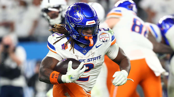 Dec 31, 2024; Glendale, AZ, USA; Boise State Broncos running back Ashton Jeanty (2) rushes the ball against the Penn State Nittany Lions during the second half in the Fiesta Bowl at State Farm Stadium. Mandatory Credit: Mark J. Rebilas-Imagn Images