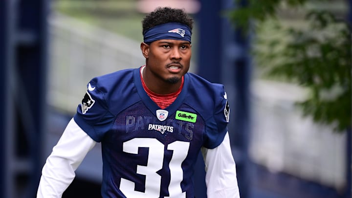 Jul 24, 2024; Foxborough, MA, USA; New England Patriots cornerback Jonathan Jones (31) walks to the practice field during training camp at Gillette Stadium. Mandatory Credit: Eric Canha-Imagn Images