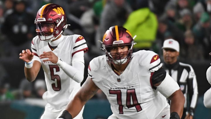 Nov 14, 2024; Philadelphia, Pennsylvania, USA; Washington Commanders offensive tackle Brandon Coleman (74) blocks for quarterback Jayden Daniels (5) against the Philadelphia Eagles at Lincoln Financial Field. Mandatory Credit: Eric Hartline-Imagn Images