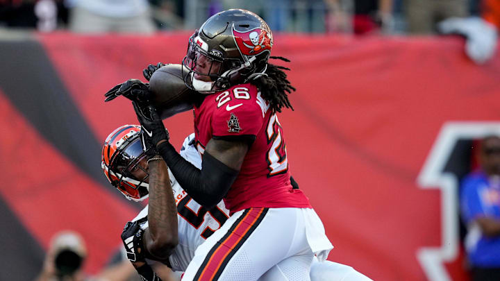 Tampa Bay Buccaneers safety Kaevon Merriweather (26) breaks up a pass in the end zone intended for Cincinnati Bengals wide receiver Tee Higgins (5) in the first quarter of the NFL Preseason Week 1 game between the Cincinnati Bengals and the Tampa Bay Buccaneers at Paycor Stadium in downtown Cincinnati on Saturday, Aug. 10, 2024.