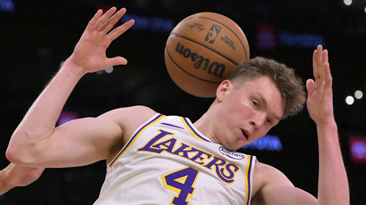  Los Angeles Lakers guard Dalton Knecht (4) dunks over Portland Trail Blazers forward Toumani Camara (33) in the second half at Crypto.com Arena.