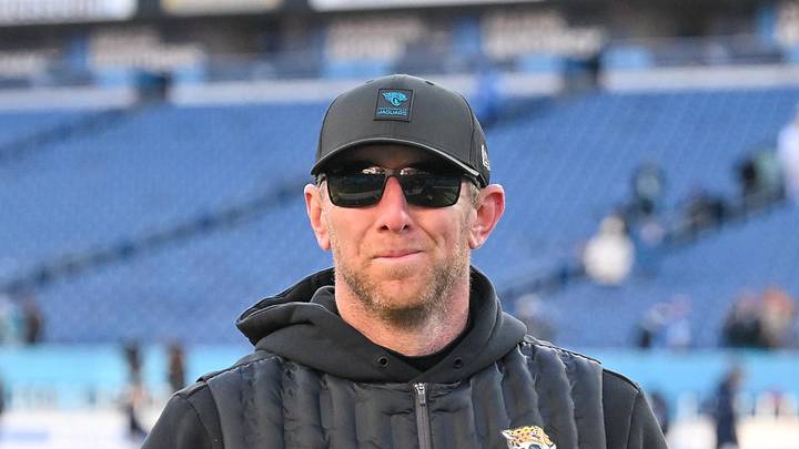 Nov 30, 2025; Nashville, Tennessee, USA;  Jacksonville Jaguars head coach Liam Coen smiles to the crowd as he walks of the field against the Tennessee Titans during the second half at Nissan Stadium. Mandatory Credit: Steve Roberts-Imagn Images