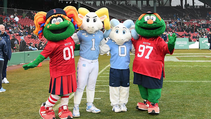 Dec 28, 2024; Boston, MA, USA; The North Carolina Tar Heels mascots Ramses (1) and R.J. (0) pose with Red Sox mascots Tessie (01) and Wally (97) before the first half against the Connecticut Huskies at Fenway Park. Mandatory Credit: Eric Canha-Imagn Images