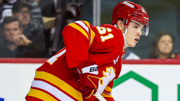 Oct 1, 2025; Calgary, Alberta, CAN; Calgary Flames right wing Matvei Gridin (51) skates with the puck against the Vancouver Canucks during the first period at Scotiabank Saddledome. Mandatory Credit: Sergei Belski-Imagn Images