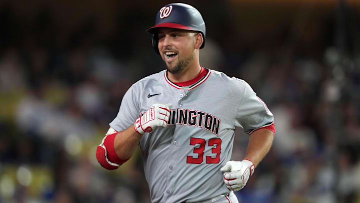 Jun 21, 2025; Los Angeles, California, USA; Washington Nationals first baseman Nathaniel Lowe (33) reacts after hitting a home run in the eighth inning against the Los Angeles Dodgers at Dodger Stadium