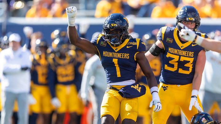 Oct 17, 2026; Morgantown, West Virginia, USA;  West Virginia Mountaineers cornerback Geimere Latimer (1) celebrates a defensive stop during the first quarter against the Cincinnati Bearcats at Milan Puskar Stadium.  Mandatory Credit: Ben Queen-Imagn Images
