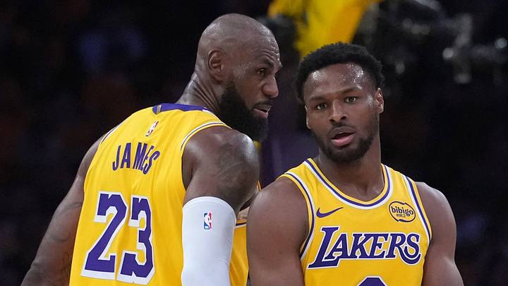 Los Angeles Lakers forward LeBron James (23) with son Bronny James (9) Los Angeles Lakers forward LeBron James (23) with son Bronny James (9)