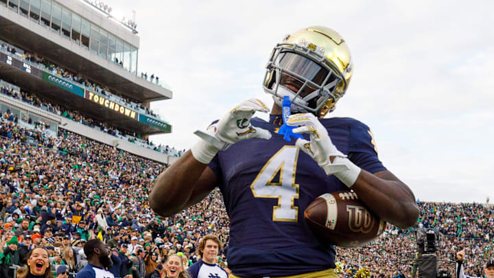 Notre Dame running back Jeremiyah Love (4) makes a heart sign after scoring a touchdown in the first half of a NCAA football game against Syracuse at Notre Dame Stadium on Saturday, Nov. 22, 2025, in South Bend.