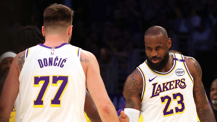 Mar 2, 2025; Los Angeles, California, USA; Los Angeles Lakers forward LeBron James (23) and guard Luka Doncic (77) react after a play during the first quarter against the LA Clippers at Crypto.com Arena. Mandatory Credit: Jason Parkhurst-Imagn Images Mar 2, 2025; Los Angeles, California, USA; Los Angeles Lakers forward LeBron James (23) and guard Luka Doncic (77) react after a play during the first quarter against the LA Clippers at Crypto.com Arena. Mandatory Credit: Jason Parkhurst-Imagn Images