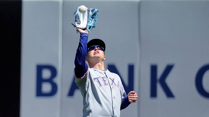 Texas Rangers right fielder Joc Pederson catches a fly ball.