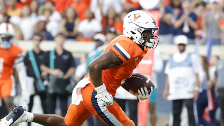Aug 30, 2025; Charlottesville, Virginia, USA; Virginia Cavaliers wide receiver Cam Ross (6) carries the ball to score a touchdown against the Coastal Carolina Chanticleers during the second quarter at Scott Stadium. Mandatory Credit: Amber Searls-Imagn Images Aug 30, 2025; Charlottesville, Virginia, USA; Virginia Cavaliers wide receiver Cam Ross (6) carries the ball to score a touchdown against the Coastal Carolina Chanticleers during the second quarter at Scott Stadium. Mandatory Credit: Amber Searls-Imagn Images