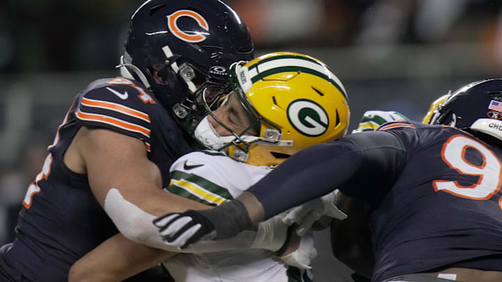 Chicago Bears defensive end Austin Booker (94) sacks and injures Green Bay Packers quarterback Jordan Love.