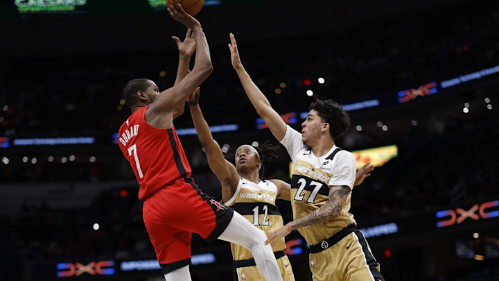 Mar 2, 2026; Washington, District of Columbia, USA; Houston Rockets forward Kevin Durant (7) shoots the ball over Washington Wizards guard Tre Johnson (12) and Wizards guard Will Riley (27) in the second half at Capital One Arena. Mandatory Credit: Geoff Burke-Imagn Images