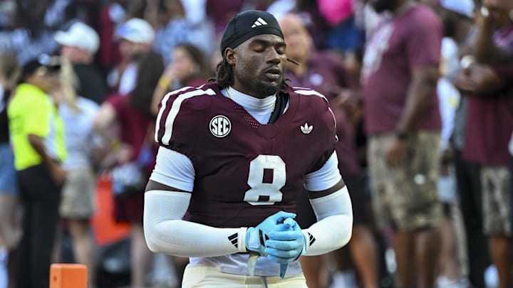 Oct 11, 2025; College Station, Texas, USA; Texas A&M Aggies running back Le'Veon Moss (8) takes a moment prior to the game against the Florida Gators at Kyle Field. Mandatory Credit: Maria Lysaker-Imagn Images Oct 11, 2025; College Station, Texas, USA; Texas A&M Aggies running back Le'Veon Moss (8) takes a moment prior to the game against the Florida Gators at Kyle Field. Mandatory Credit: Maria Lysaker-Imagn Images