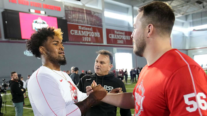 Ohio State Buckeyes offensive lineman Josh Simmons gets a high five from offensive lineman Seth McLaughlin high after his pro day workout for NFL scouts at the Woody Hayes Athletic Cente on March 26, 2025.