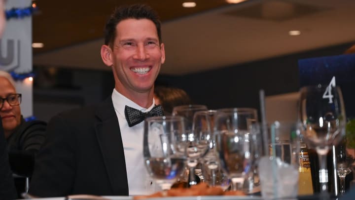 Red Sox Chief Baseball Officer Craig Breslow sits at a table with his family at the Second Annual WooSox Foundation Honor Gala.