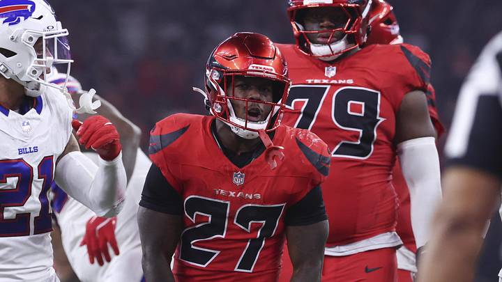 Nov 20, 2025; Houston, Texas, USA; Houston Texans running back Woody Marks (27) reacts after running for a first down during the game against the Buffalo Bills at NRG Stadium. Mandatory Credit: Troy Taormina-Imagn Images