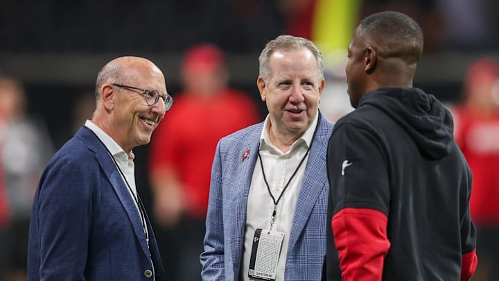 Tampa Bay Buccaneers owner Joel Glazer and owner Bryan Glazer talk to Atlanta Falcons. Tampa Bay Buccaneers owner Joel Glazer and owner Bryan Glazer talk to Atlanta Falcons.