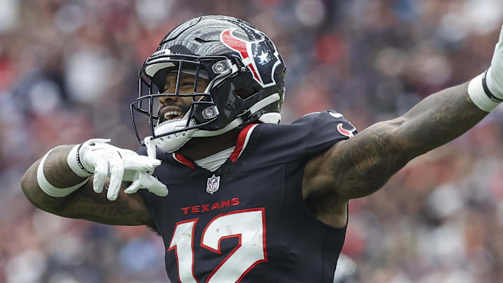Sep 29, 2024; Houston, Texas, USA; Houston Texans wide receiver Nico Collins (12) signals after a first down during the first quarter against the Jacksonville Jaguars at NRG Stadium. Mandatory Credit: Troy Taormina-Imagn Images