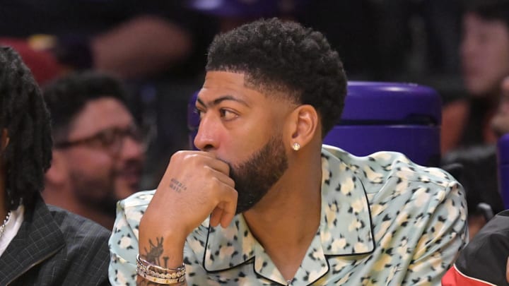 Mar 30, 2026; Los Angeles, California, USA; Washington Wizards forward Anthony Davis (23), center, looks on from the bench during the first half against the Los Angeles Lakers at Crypto.com Arena. Mandatory Credit: Jayne Kamin-Oncea-Imagn Images