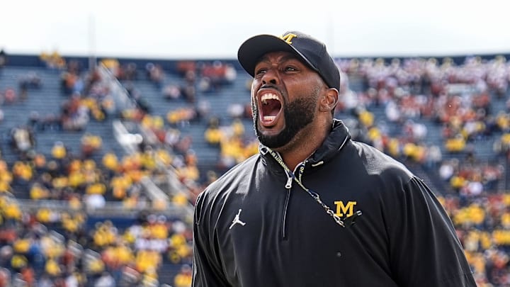 Sep 7, 2024; Ann Arbor, Michigan, USA; Michigan head coach Sherrone Moore cheers with the student section during warm ups at Michigan Stadium. Mandatory Credit: Junfu Han-USA TODAY Network via Imagn Images Sep 7, 2024; Ann Arbor, Michigan, USA; Michigan head coach Sherrone Moore cheers with the student section during warm ups at Michigan Stadium. Mandatory Credit: Junfu Han-USA TODAY Network via Imagn Images