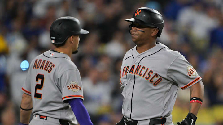 Giants first baseman Rafael Devers, right, and shortstop Willy Adames have both underperformed to their contracts in San Francisco.