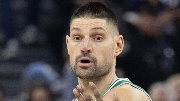 Feb 19, 2026; San Francisco, California, USA; Boston Celtics center Nikola Vucevic (4) looks to pass around Golden State Warriors guard De'Anthony Melton (8) during the first quarter at Chase Center. Mandatory Credit: D. Ross Cameron-Imagn Images